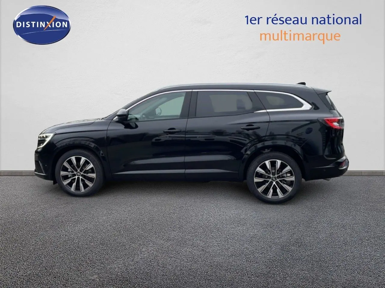 Profil droit d'un Renault Espace 2025 noir étoile métal, SUV hybride avec jantes alliage et lignes élégantes.