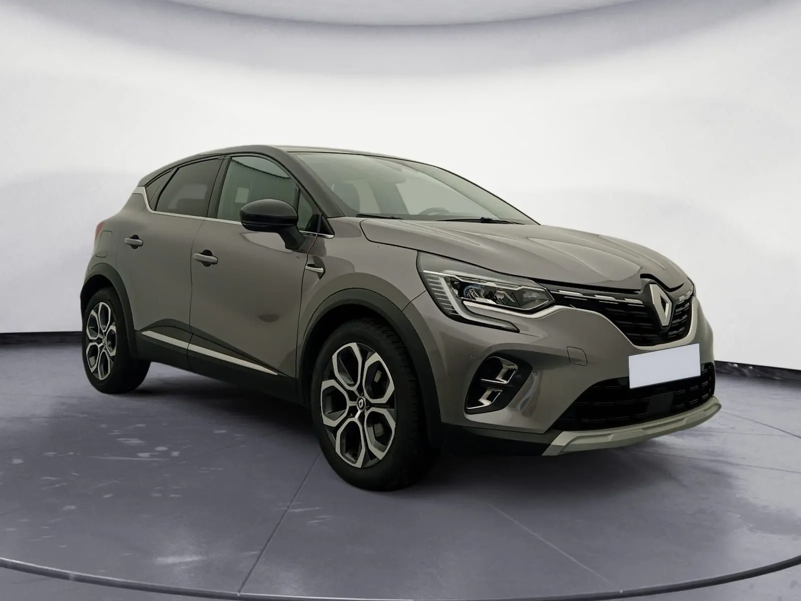 Renault Captur 1.3 Mild Hybrid 140 Techno gris cassiopée et noir, vue 3/4 avant avec jantes alliage distinctives.