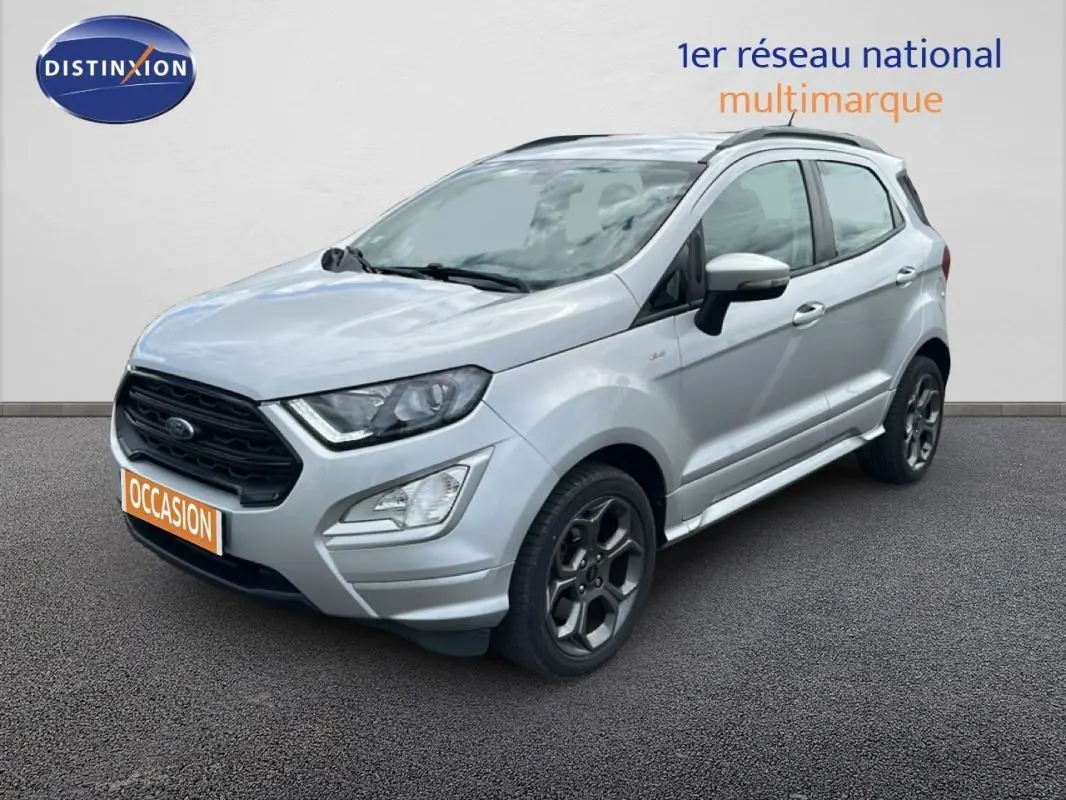 Vue 3/4 avant droit d'un Ford EcoSport gris clair avec jantes alliage et barres de toit visibles.