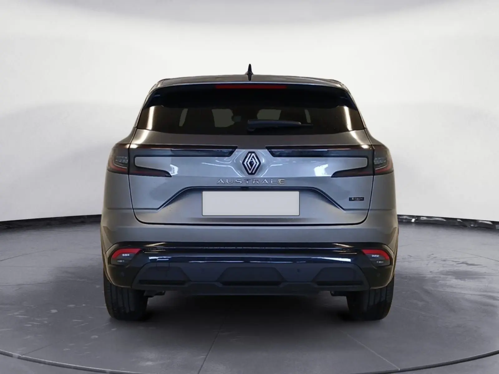 Vue arrière du Renault Austral gris métallisé avec feux LED fins et logo central bien visible.