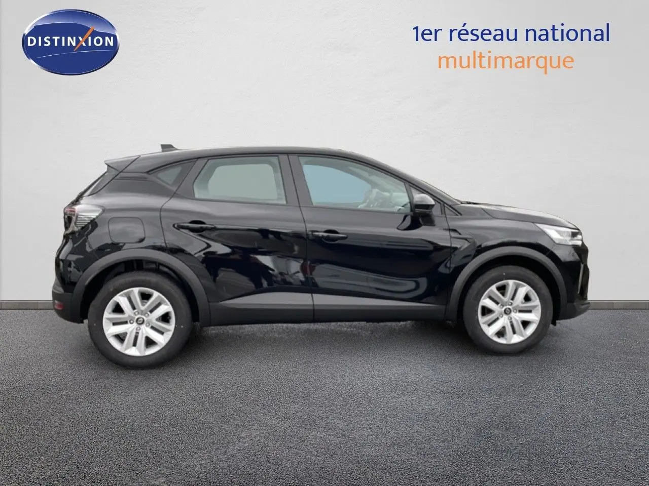 Profil droit d'un Renault Captur 2025 noir étoile métal, version 1.0 TCE 90CH Evolution avec jantes argentées.