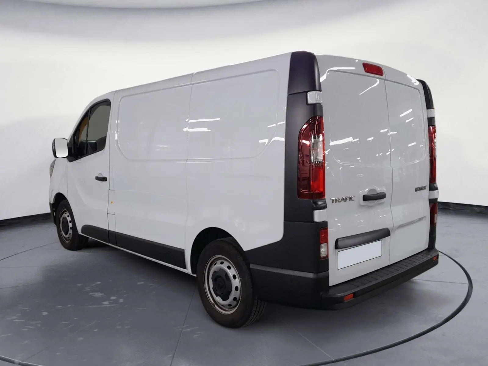 Vue 3/4 arrière droite du Renault Trafic Fourgon blanc minéral 2024 avec portes arrière fermées et éléments noirs contrastants.