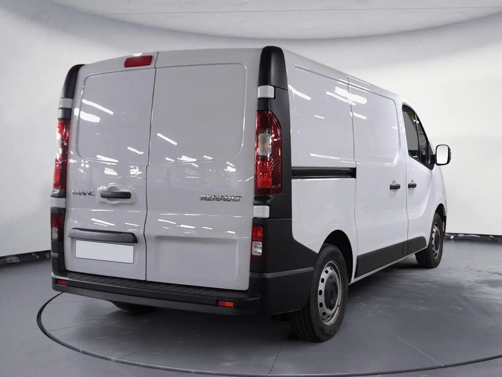 Renault Trafic Fourgon blanc minéral vu en 3/4 arrière droit, avec portes arrière fermées et feux rouges verticaux.