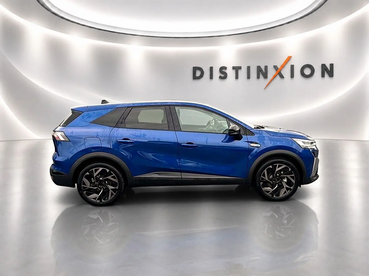 Renault Symbioz bleu iron en profil droit, SUV hybride avec jantes alu noires et toit noir brillant.