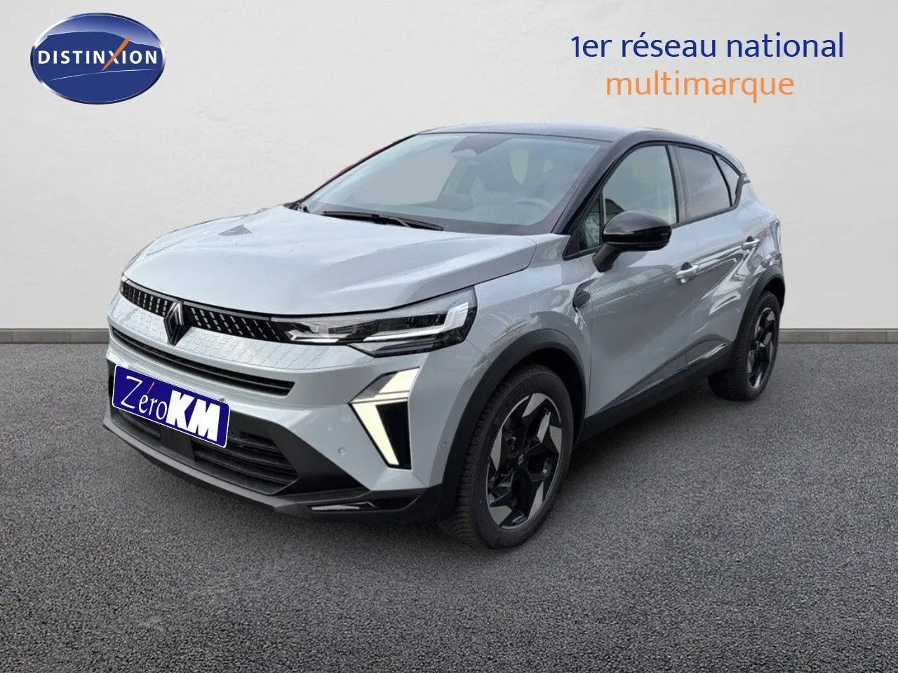 Renault Captur II hybride gris Rafale métal avec toit noir, vue 3/4 avant droit sur sol gris.