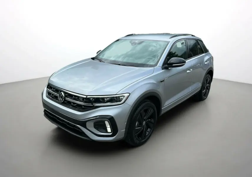 Volkswagen T-Roc TDI 150 R-Line Black gris pyrite en 3/4 avant droit avec jantes noires et barres de toit noires.
