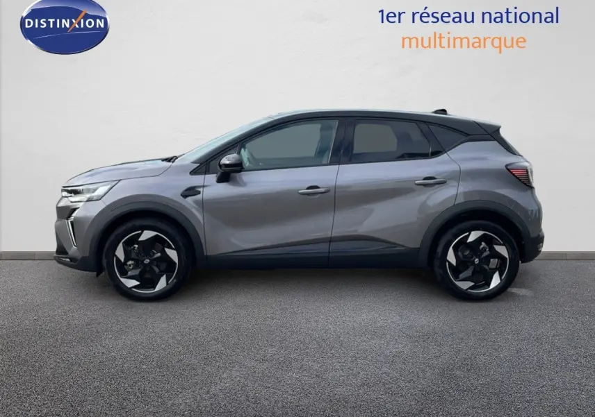 Profil côté gauche du Renault Captur 1.6 E-TECH hybride gris cassiopée avec toit noir, roues alliage bicolores.