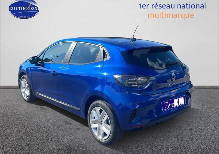 Renault Clio V bleu iron vue 3/4 arrière droit avec feux arrière LED et jantes alliage.