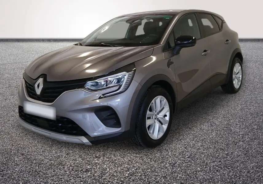 Renault Captur gris foncé vue 3/4 avant droit, mettant en valeur ses phares LED et sa calandre noire distinctive.