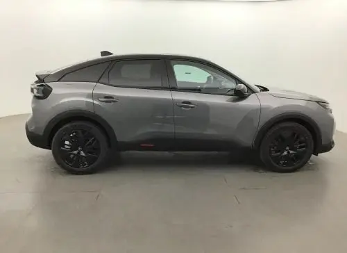 Profil droit d'une Citroën C4 hybride 2025 gris Mercury avec jantes noires et toit noir contrasté.