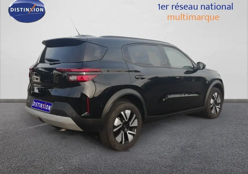 Opel Frontera noir Karbon en vue 3/4 arrière droit, avec jantes bi-ton et feux arrière LED distinctifs.