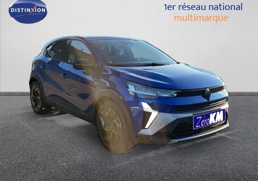 Renault Captur E-Tech hybride bleu Iron Metal avec toit noir, vue 3/4 avant droit mettant en valeur ses optiques LED.