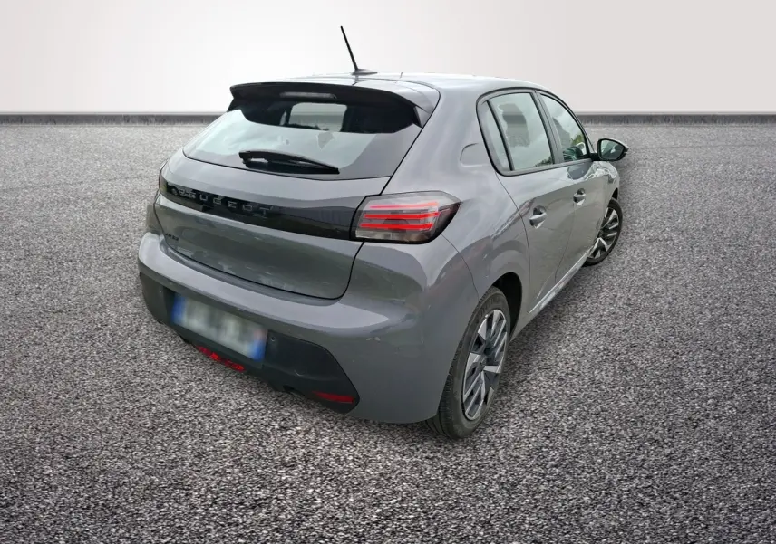 Peugeot 208 gris foncé vue 3/4 arrière droit, feux LED et jantes alliage distinctives visibles.