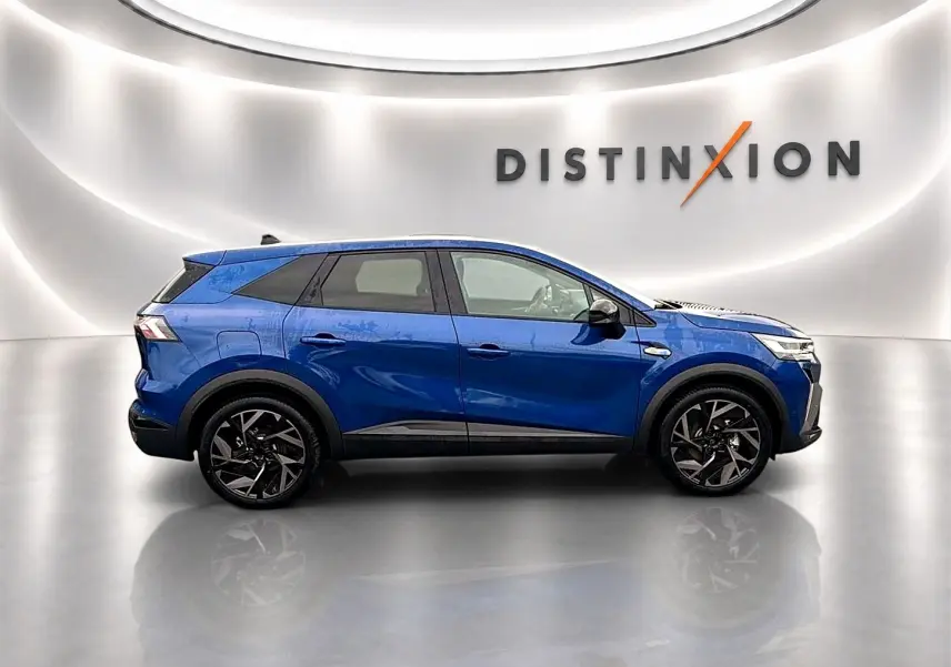 Profil droit du Renault Symbioz 1.8 e-tech hybride 160 esprit alpine en bleu iron, jantes alu noires stylées.