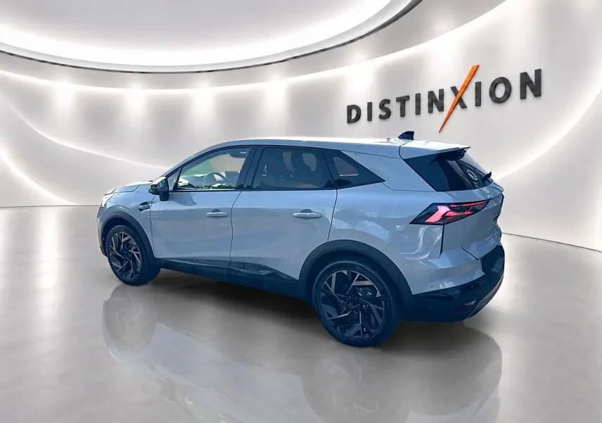 Renault Symbioz gris rafale vu de profil droit, avec jantes noires et feux arrière LED distinctifs.
