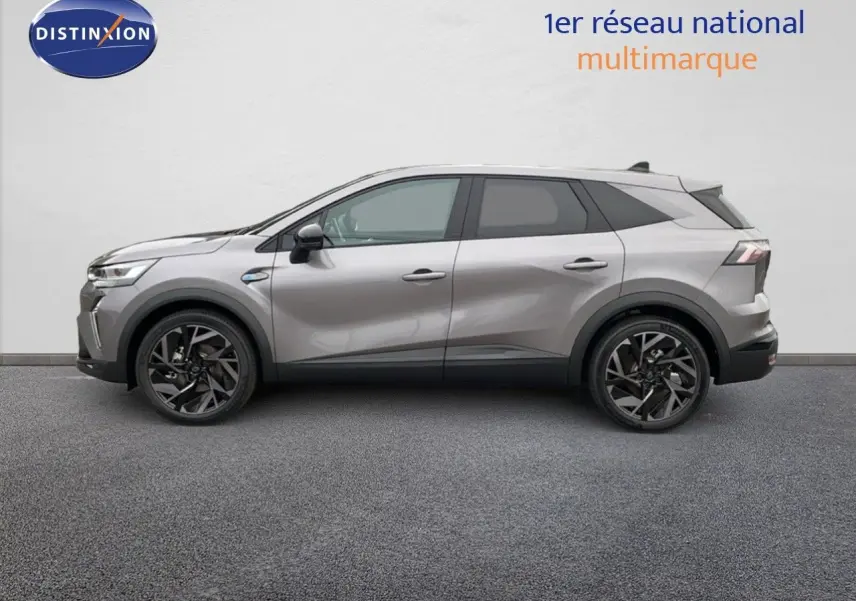 Profil côté gauche du Renault SYMBIOZ gris cassiopée métal, SUV hybride 2025 avec jantes noires distinctives.