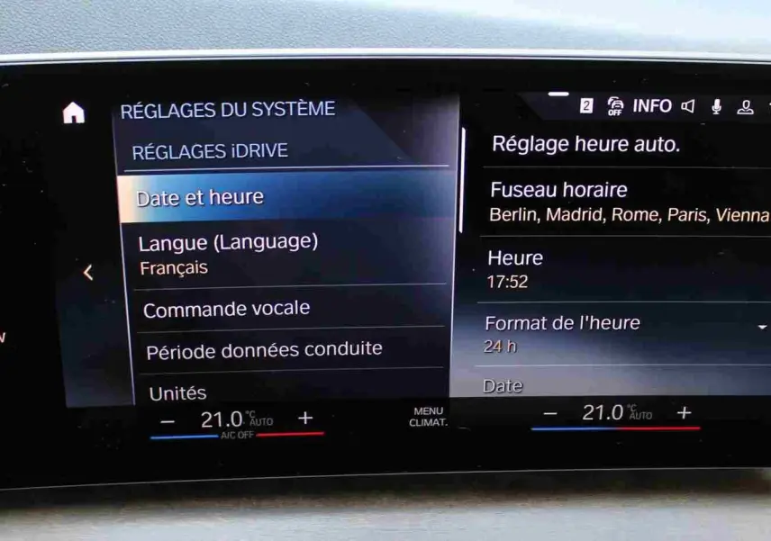 Écran central tactile intérieur de la BMW Série 2 Active Tourer 218d 2023 affichant les réglages de date, heure et langue.