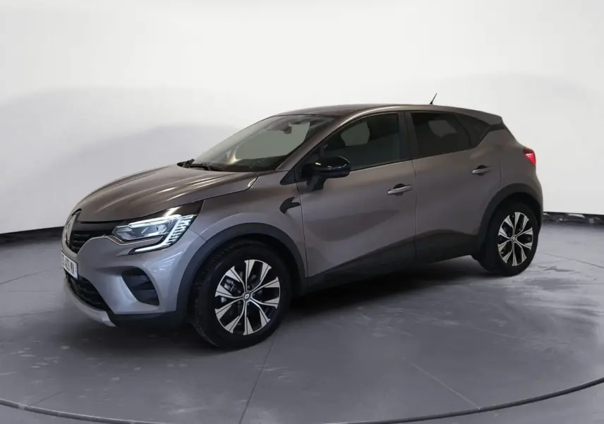 Renault Captur E-Tech Full Hybrid 145 Evolution gris Cassiopée en 3/4 avant droit, jantes alliage et détails noirs contrastants.