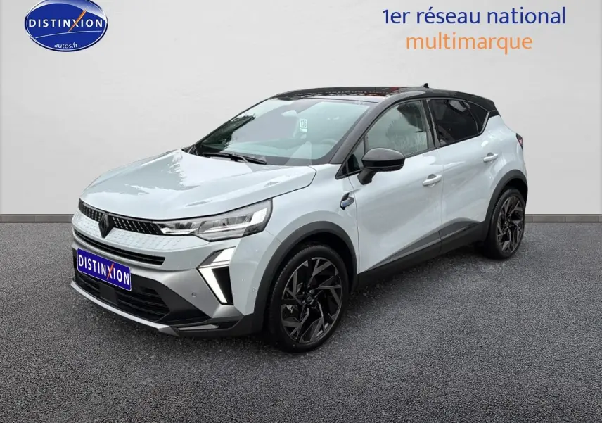Renault Captur 1.8 e-tech gris rafale avec toit noir, vue 3/4 avant droit, jantes alu noires et feux LED.