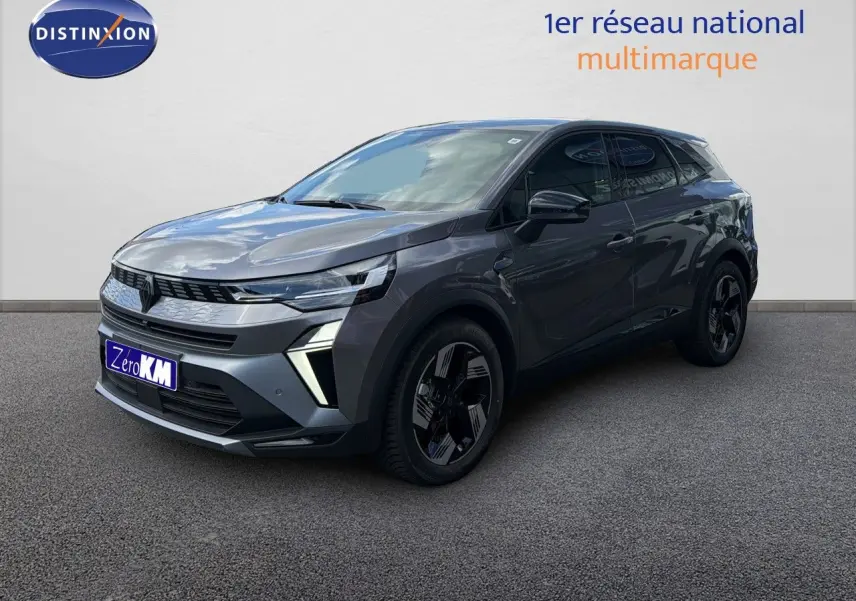 Renault Symbioz gris cassiopée métal, vue 3/4 avant droit, SUV hybride avec feux LED et jantes noires distinctives.