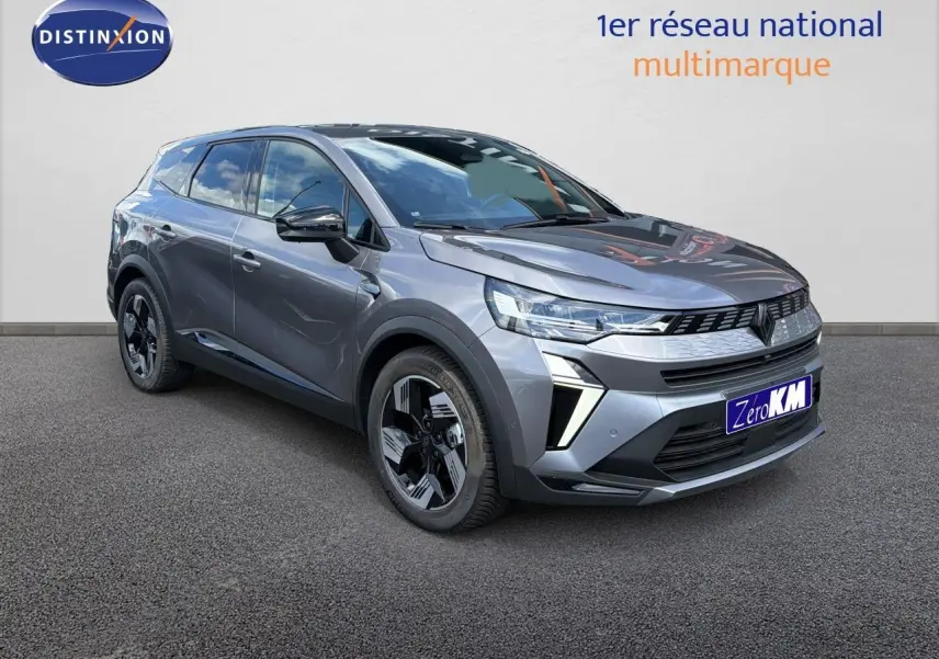 Renault Symbioz gris cassiopée métal en 3/4 avant droit, SUV hybride avec jantes noires et détails modernes LED.