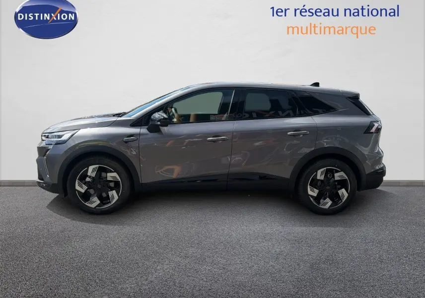 Profil droit du Renault Symbioz gris cassiopée métal 2026, SUV hybride avec jantes noires et détails modernes.