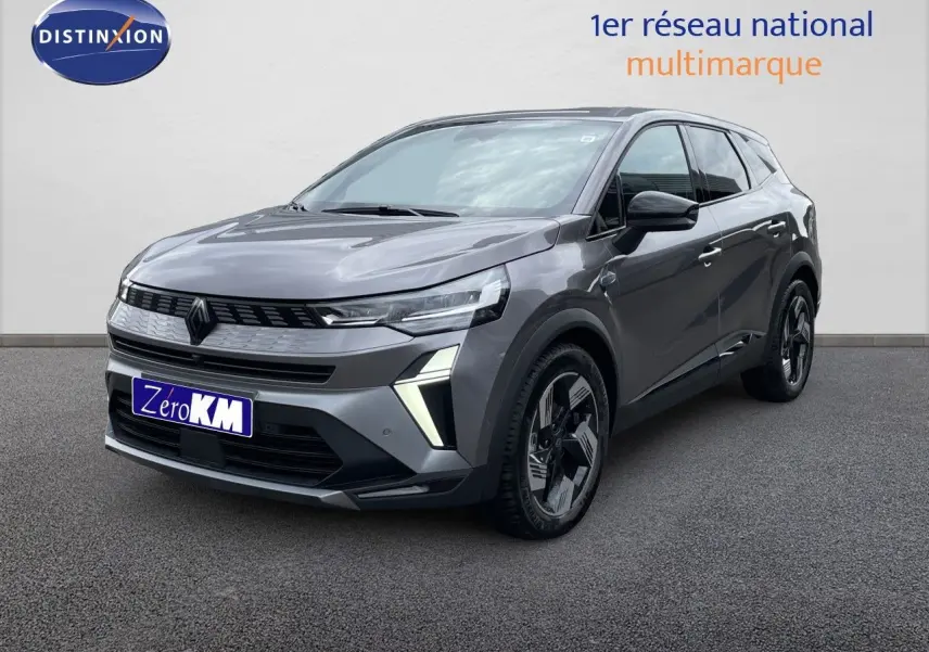 Vue 3/4 avant d'un Renault Symbioz gris cassiopée métal avec feux LED distinctifs et jantes stylisées.