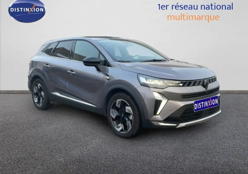 Renault Symbioz gris casiopee metal en 3/4 avant droit, SUV hybride avec signature lumineuse LED distinctive.