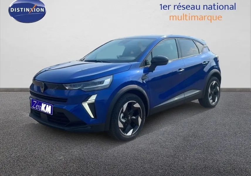 Renault Captur MILD HYBRID 140ch en bleu Iron Metal, vue 3/4 avant droit avec jantes bicolores distinctives.