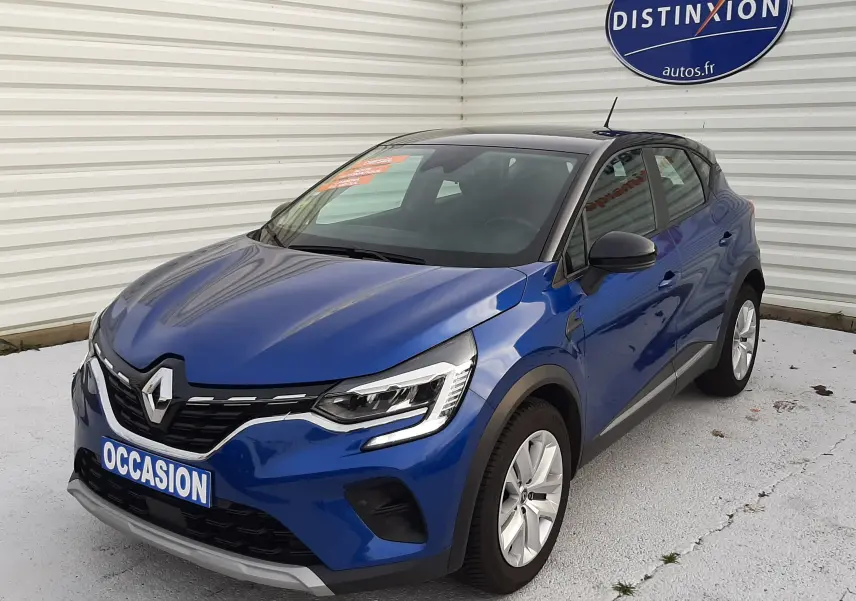 Renault Captur 1.5 Blue dCi 115ch Business 2020 bleu Iron avec toit noir, vue 3/4 avant droit, calandre et phares LED visibles.