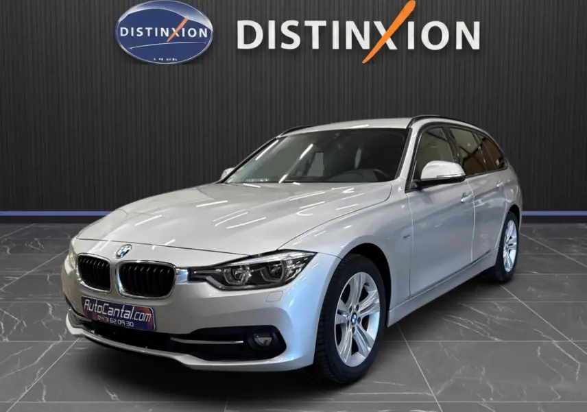 BMW Série 3 Touring F31 gris aluminium vue 3/4 avant droit, avec jantes alliage et calandre double haricot distinctive.