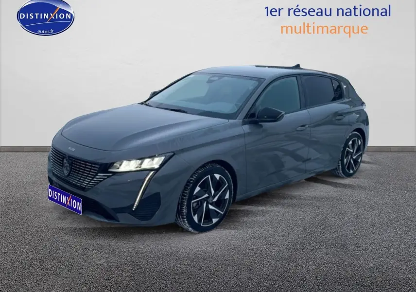 Peugeot 308 gris sélénite en vue 3/4 avant droit, avec phares LED et jantes alliage distinctives.