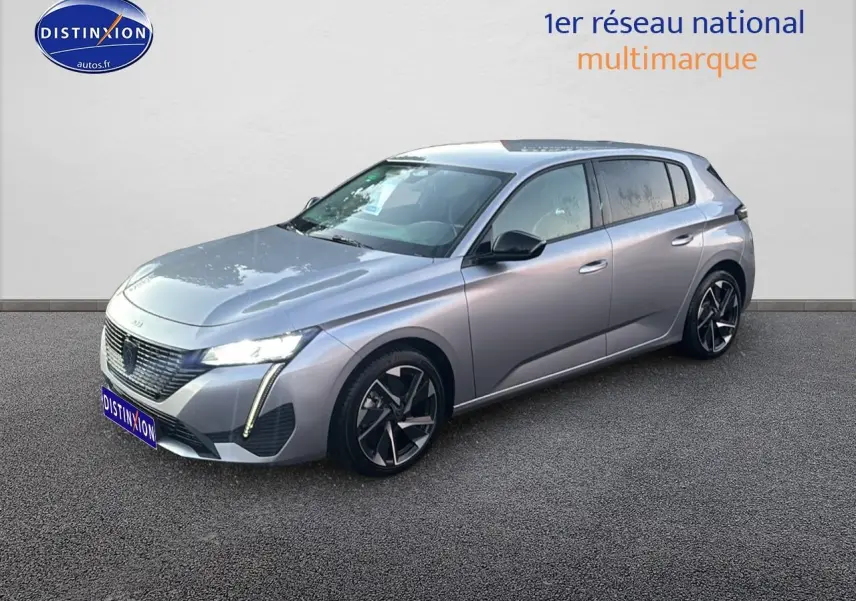 Peugeot 308 gris Artense vue 3/4 avant droit avec phares LED et jantes alliage distinctives.