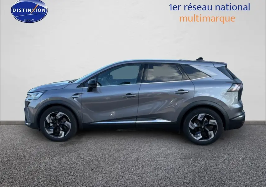 Profil droit du Renault Symbioz gris 2025 avec jantes noires et toit surélevé, sur fond neutre.