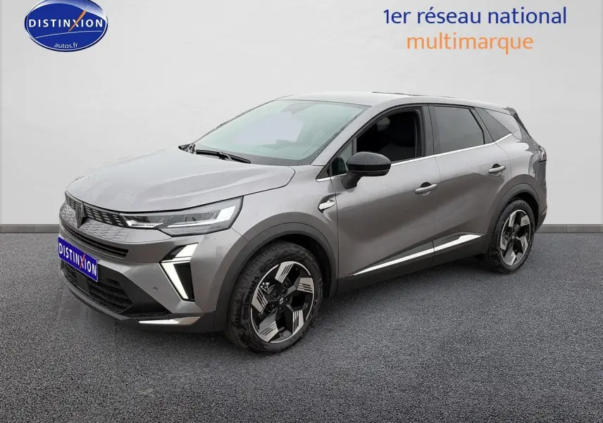 Renault Symbioz gris schiste en 3/4 avant droit, avec jantes alliage 18 pouces et feux LED distinctifs.