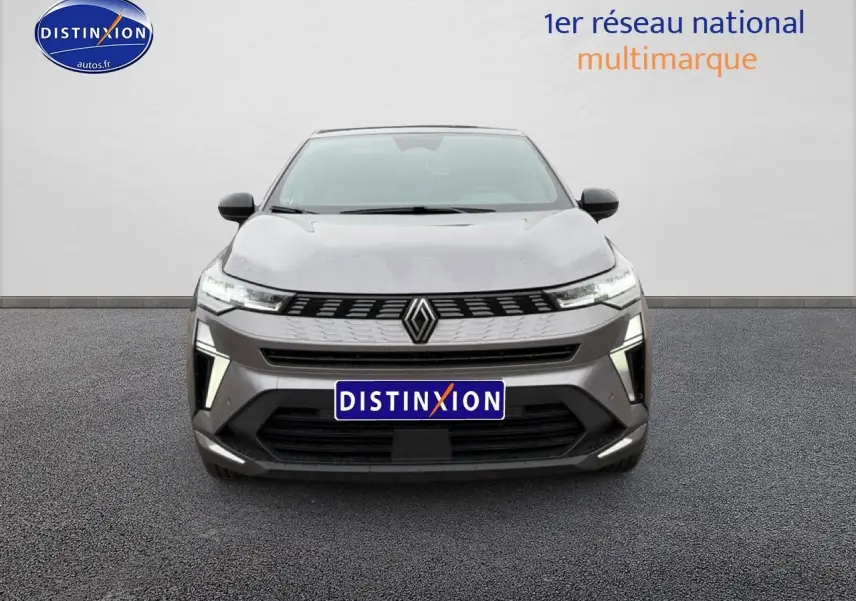 Vue de face du Renault Symbioz gris schiste 2026 avec calandre moderne et feux LED distinctifs allumés.