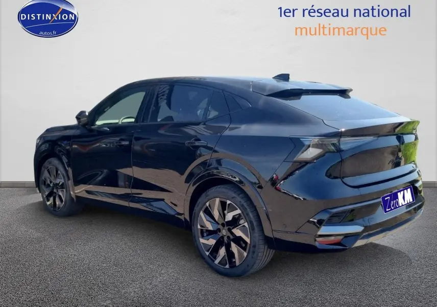 Vue 3/4 arrière droite du Renault Rafale noir étoile avec jantes alu et becquet arrière distinctif.