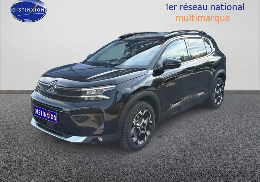 Citroën C5 Aircross noir perla nera vue 3/4 avant droit avec jantes alu et barres de toit visibles.
