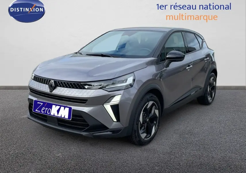 Renault Captur E-Tech hybride gris cassiopée métal avec toit noir, vue 3/4 avant droit mettant en valeur ses feux LED distinctifs.