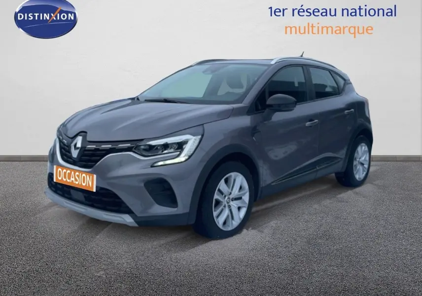 Renault Captur 1.0 TCE GPL Business gris cassiopée métal en 3/4 avant droit avec plaque occasion orange.