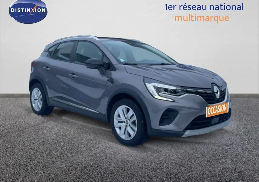 Renault Captur gris Cassiopée métal en 3/4 avant droit avec calandre noire et jantes argentées.
