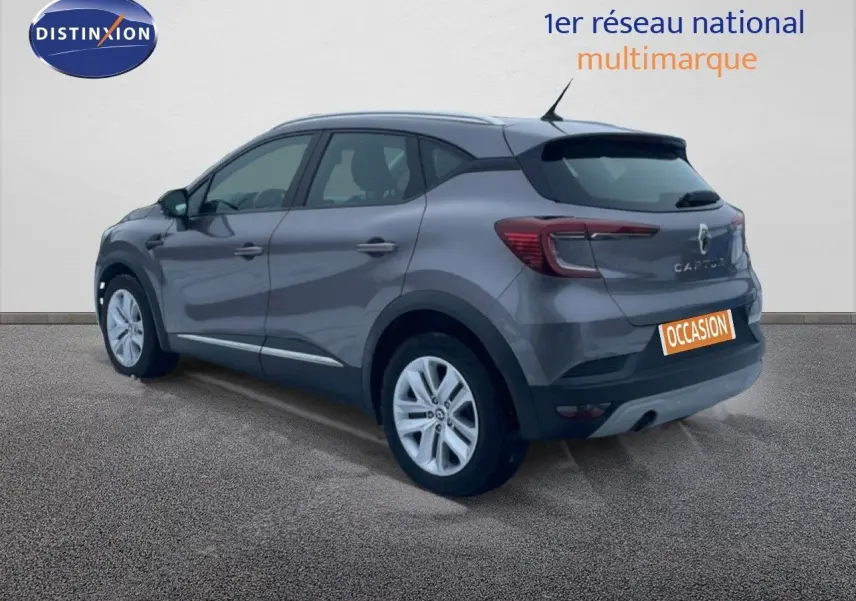 Renault Captur gris Cassiopée métal en 3/4 arrière droit, SUV compact avec feux arrière LED et jantes alliage.