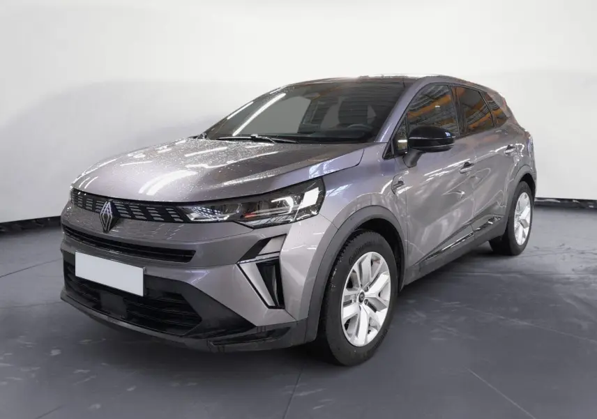 Renault Symbioz E-Tech Full Hybrid gris cassiopée, vue 3/4 avant droit, avec calandre moderne et jantes blanches.