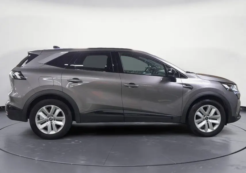 Profil côté gauche du Renault SYMBIOZ E-TECH Full Hybrid 145 gris Cassiopée, SUV hybride 2025 avec lignes épurées et jantes argentées.