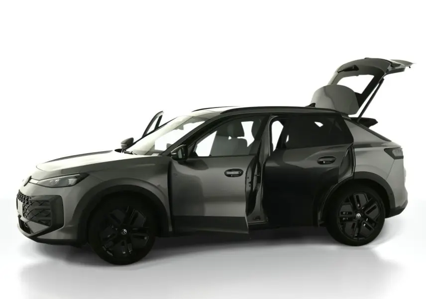 Volkswagen T-Roc gris Loup vue de profil gauche avec portes avant et arrière ouvertes et coffre relevé.