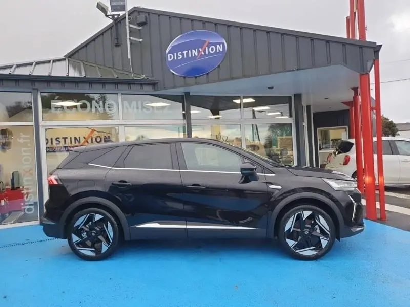 Profil droit d'une Renault SYMBIOZ 1.6 E-Tech noir étoilé, avec jantes alu noires et détails chromés visibles.