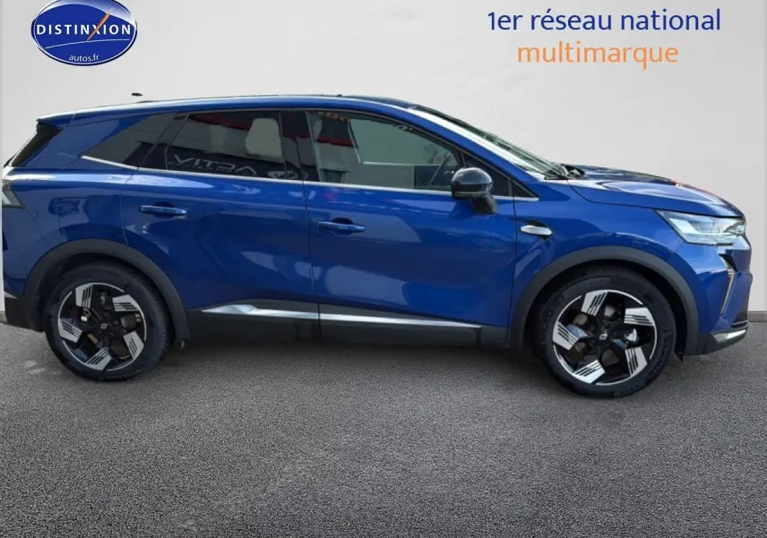 Vue latérale droite du Renault Symbioz 2025 bleu iron metal avec jantes distinctives et barres de toit.
