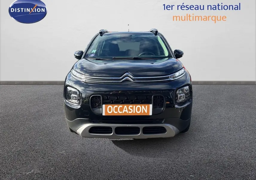 Vue frontale d'un Citroën C3 Aircross noir Perla Metal avec calandre distinctive et plaque "OCCASION" orange.