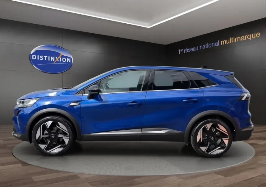 Vue profil côté gauche du Renault SYMBIOZ Iconic E-Tech 145 bleu avec jantes noires et détails argentés.