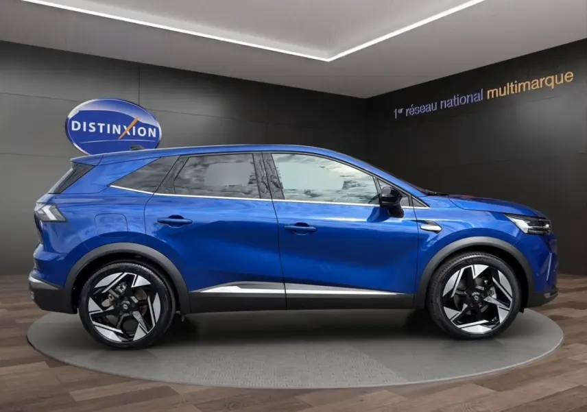 Renault SYMBIOZ bleu en profil droit, SUV hybride avec jantes noires et détails chromés sous les portes.